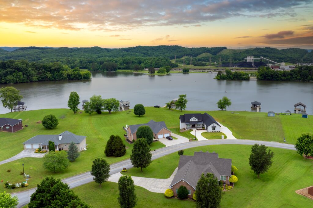 Custom home under construction in East Tennessee with scenic mountain background, representing pricing breakdown and build quality by Olson Custom Homes.