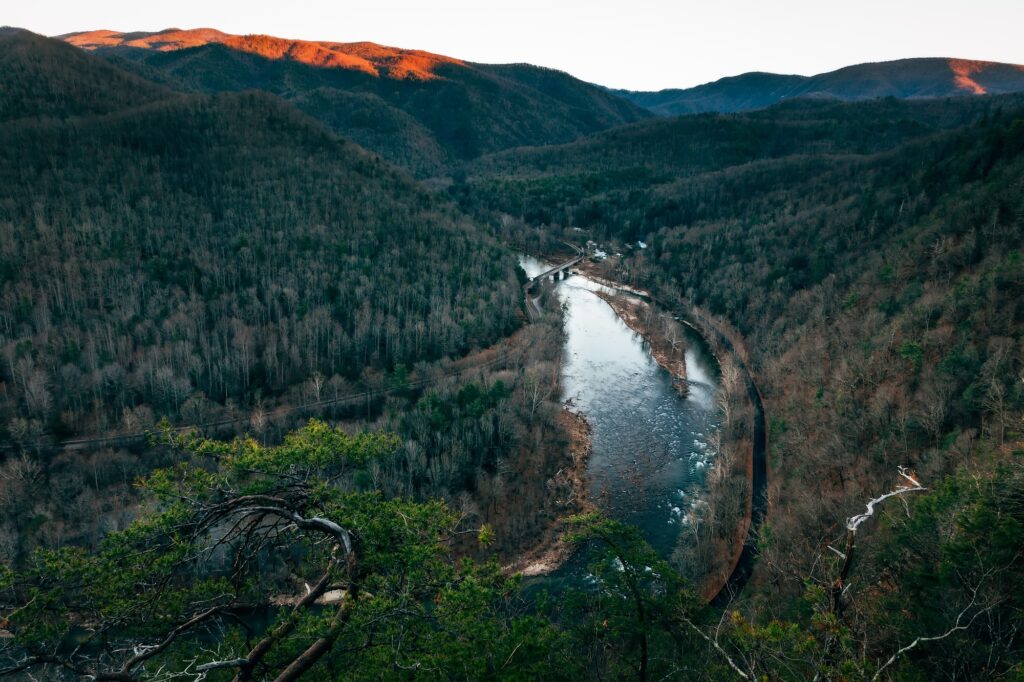 Retired couple enjoying mountain views from custom home deck in East Tennessee.